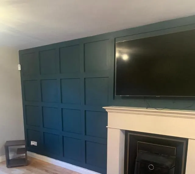 Living room after, with a panelled feature wall
