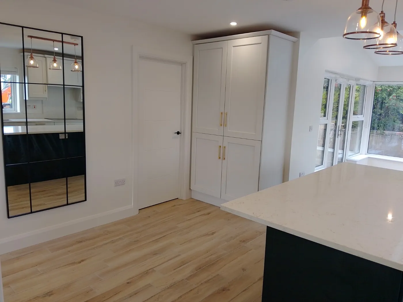 Shaker kitchen with a stone-topped island at handover