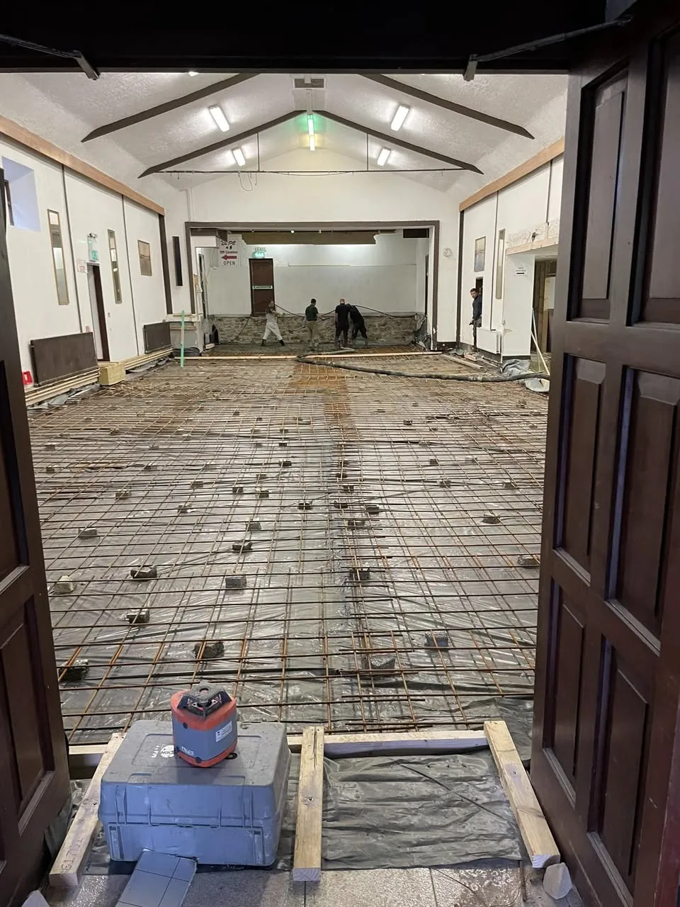 Steel mesh laid across a hall floor ready for a structural slab