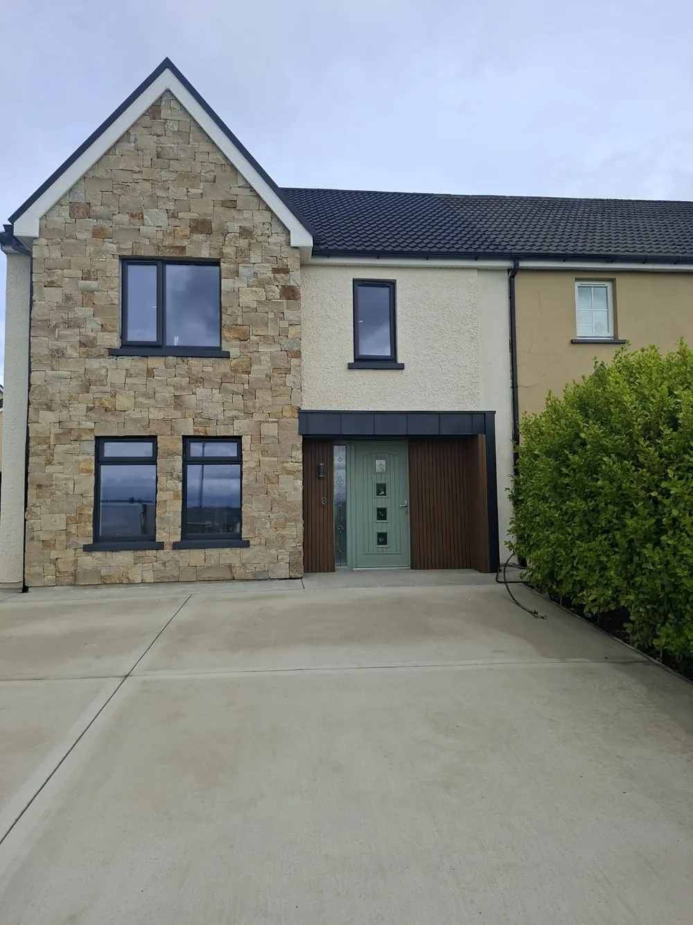 Semi-detached home in Letterkenny with a stone front and a new porch