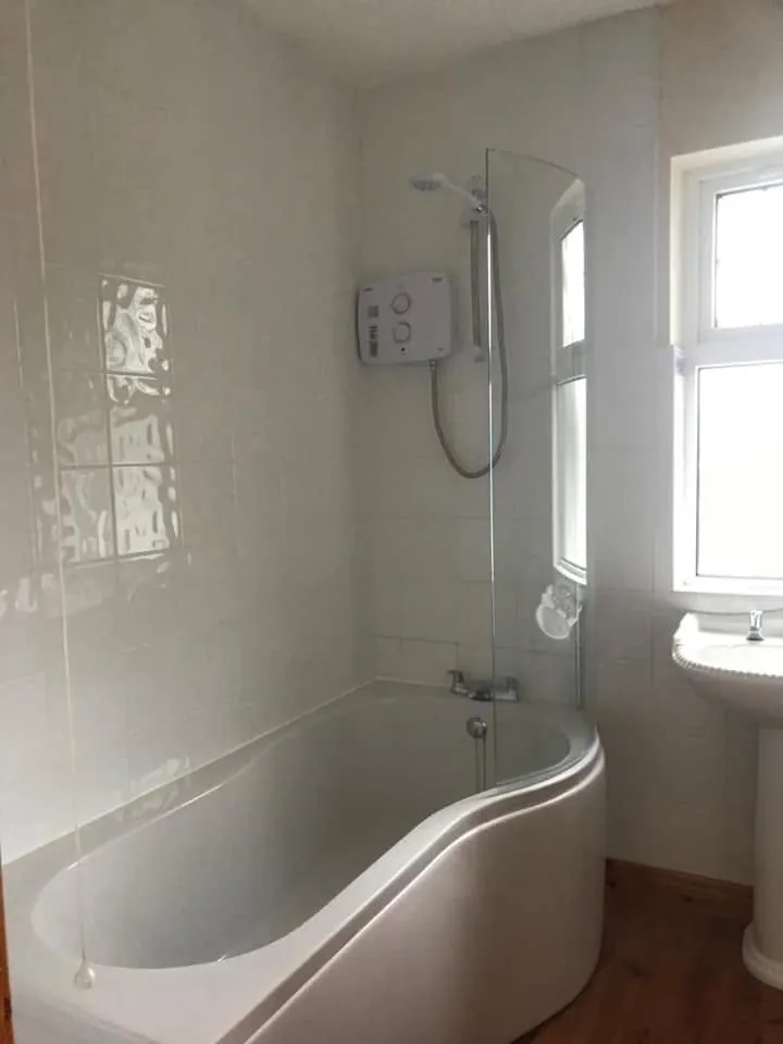 Bathroom with a new bath and shower