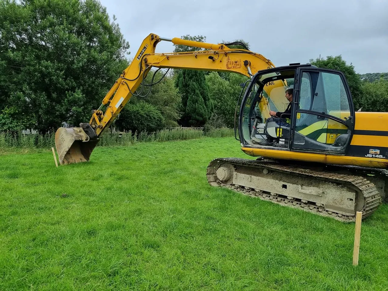 Excavator opening the ground on a green field site