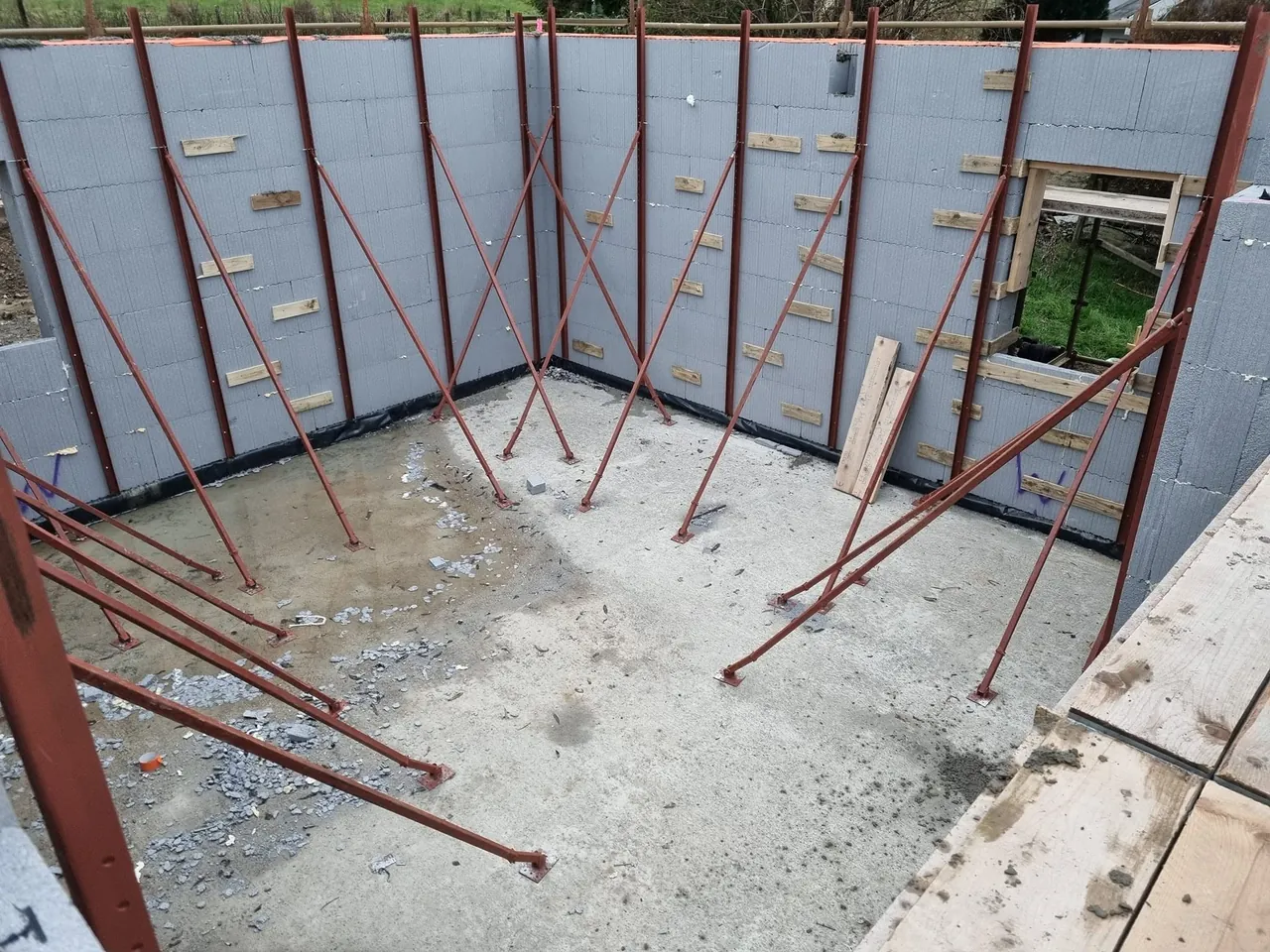 Braced ICF walls rising on a slab