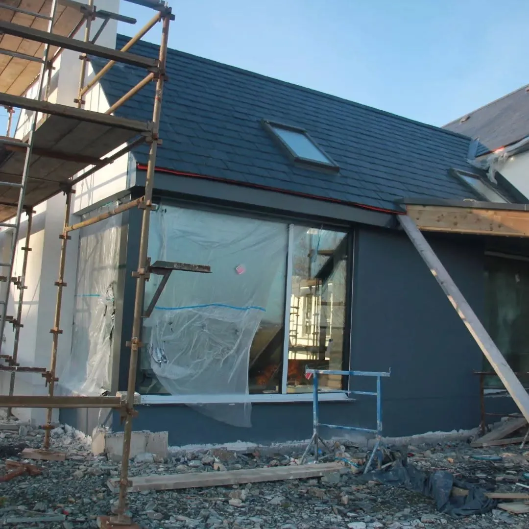 Dark render going on the ground floor of an ICF house, scaffold still up
